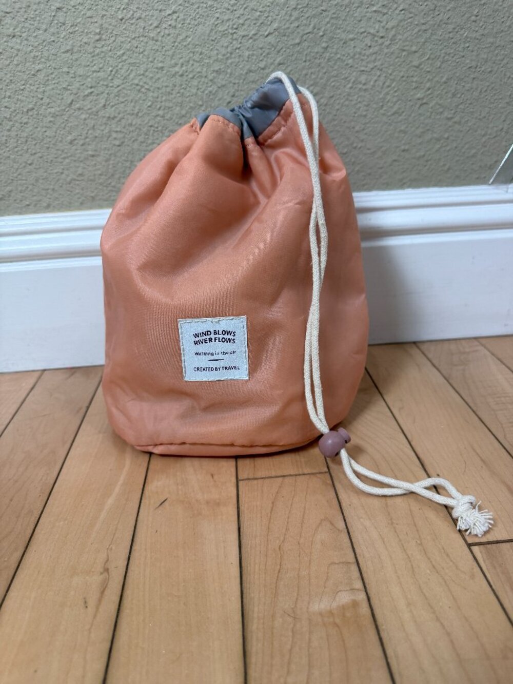 Created by Travel Round padded pink polyester drawstring travel cosmetic pouch